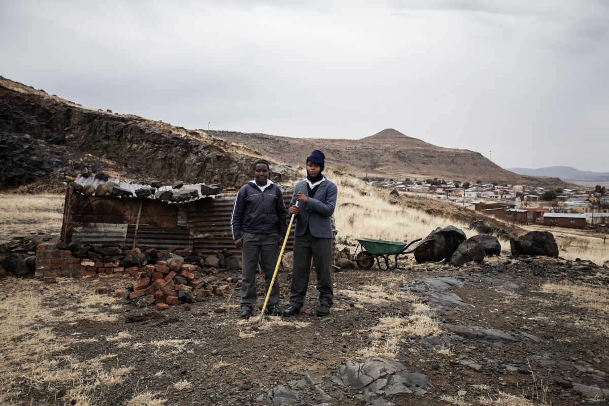 Mivuyo Rolomane (12) and Mandiluve Cetayo (14) in front of their pig sty.