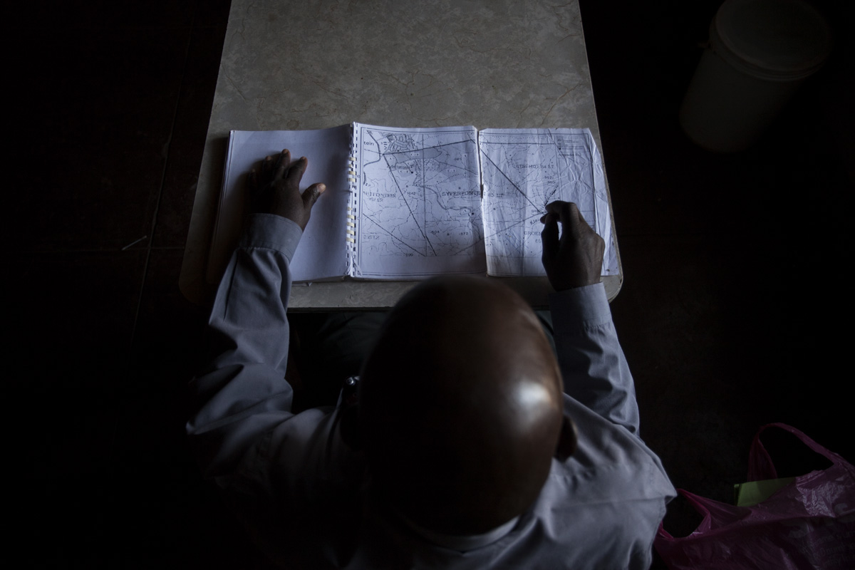 Eddy Baloye from the Shimange Tribal Community points out the borders of the farm, Syferfontein, they claimed.