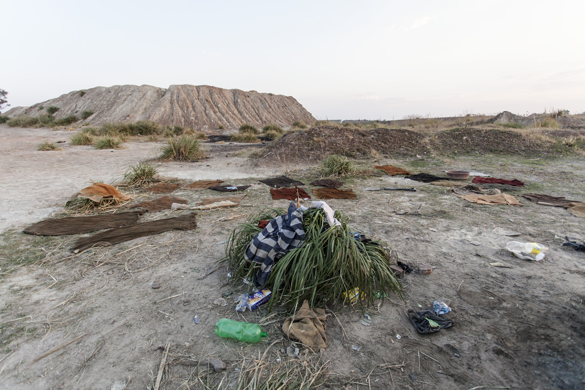 Carpets used in the gold extraction process are left out to dry after a day's work.